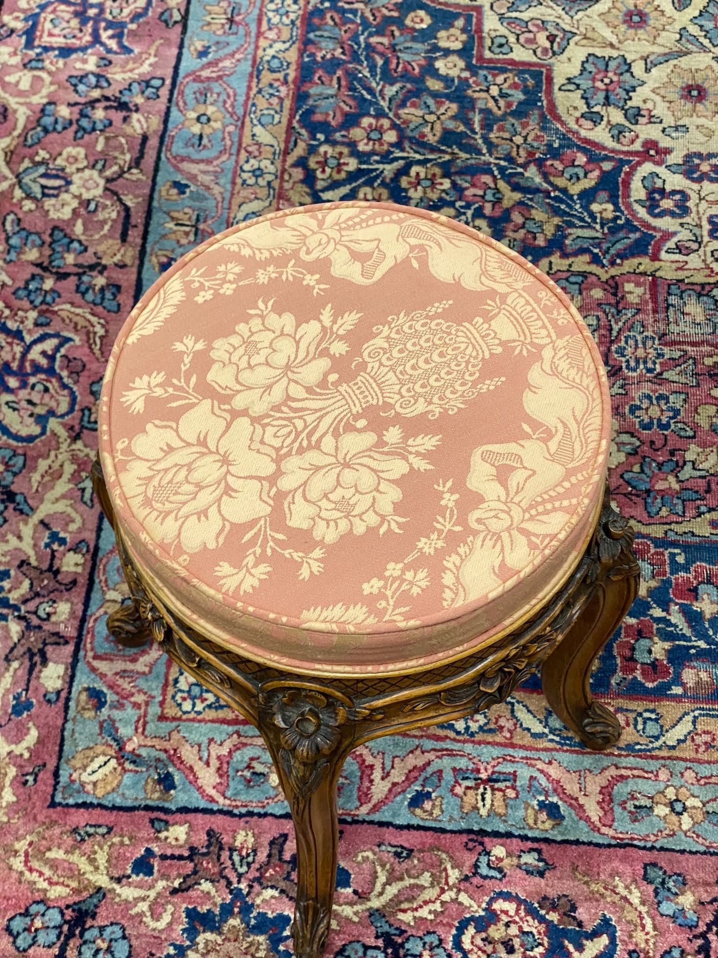 An early 20th century French carved walnut dressing stool